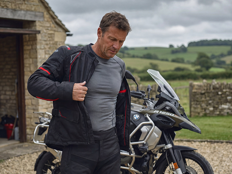 Man putting on Gore-Tex jacket